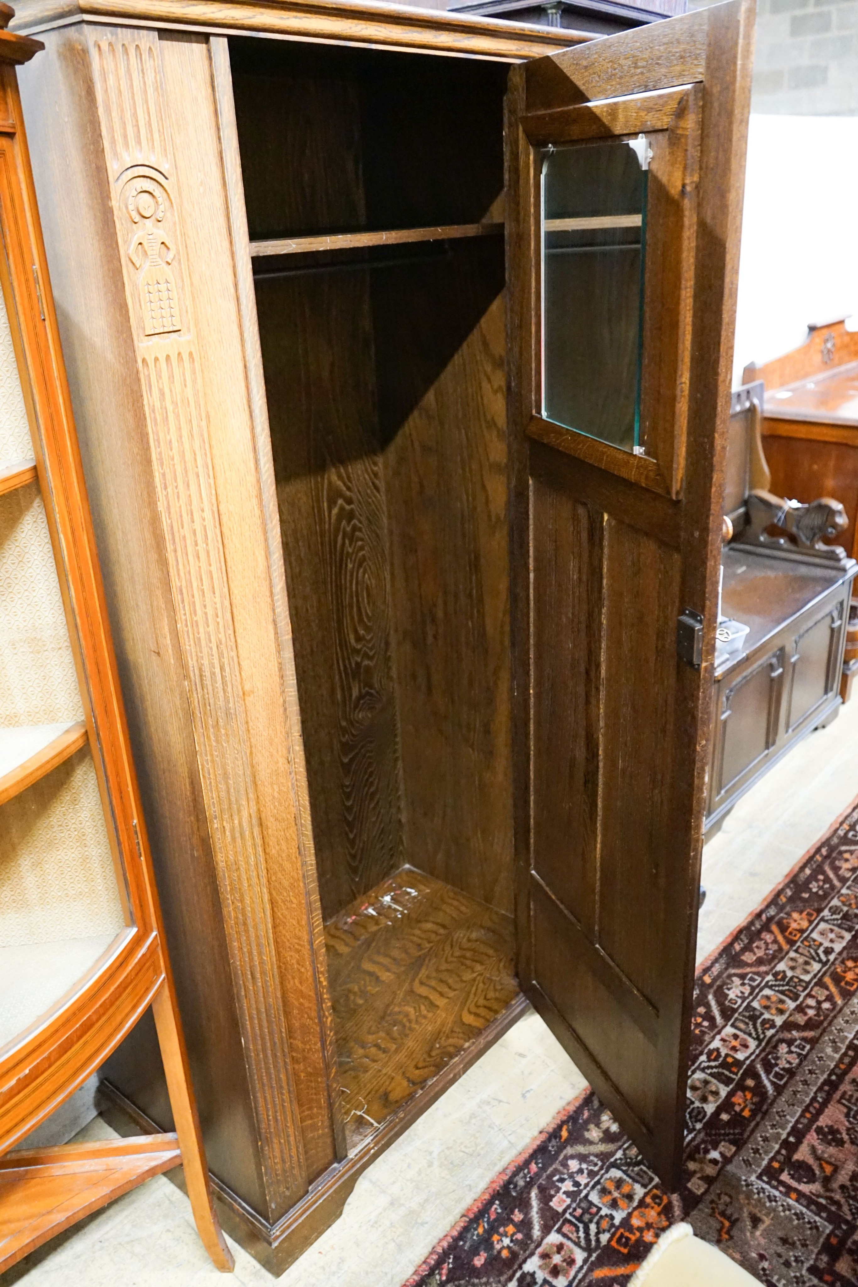 An 18th century style carved oak hall cupboard, length 91cm, depth 50cm, height 180cm